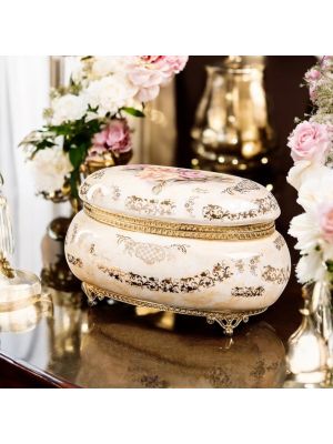 Box, elegant jewelry box in luxurious ceramic, with refined gold details.